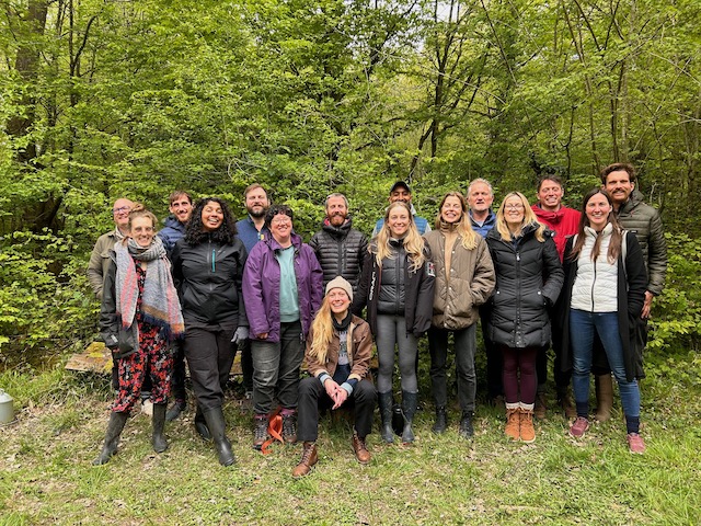 Cohort 3 of the Regenerative Design Lab posing for a group photo at Hazel Hill Wood